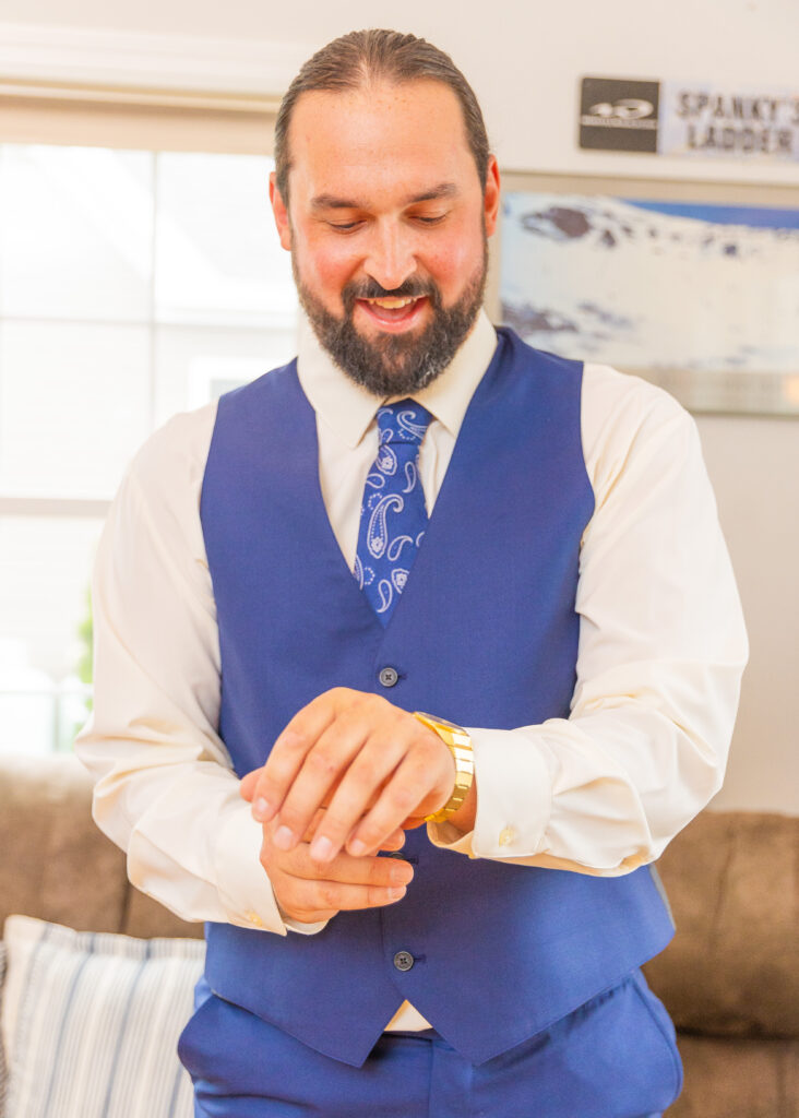 Groom adjusts his watch