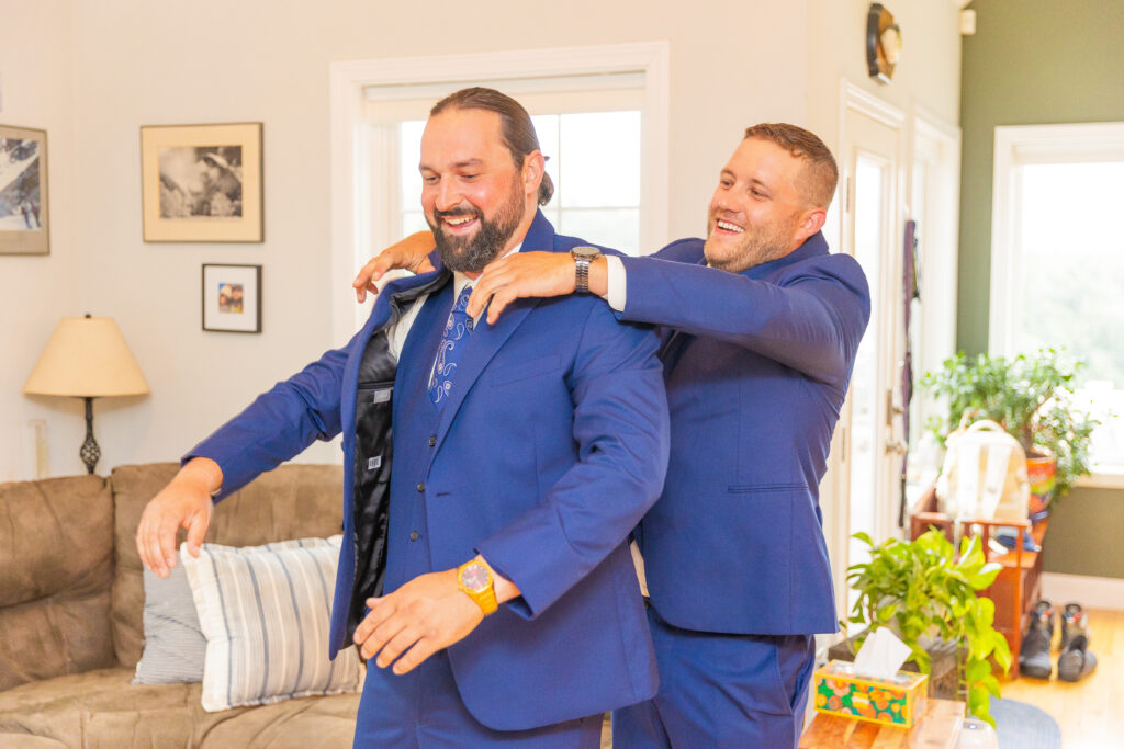 Groom puts his jacket on