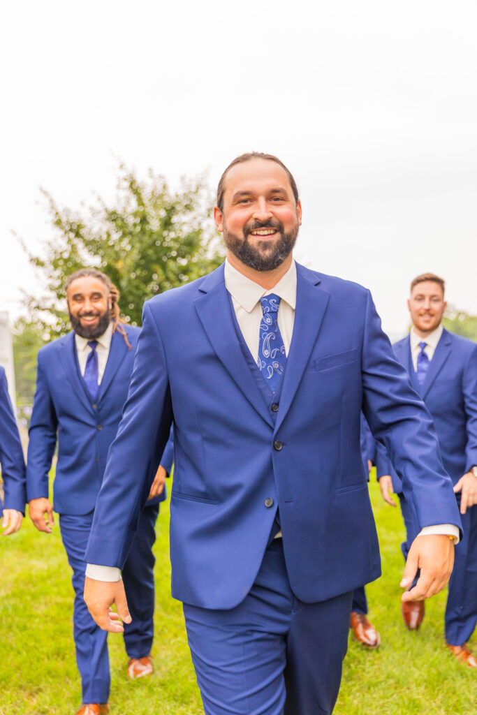 Groom laughs candidly.