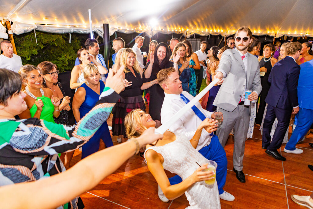 bride and groom dancing at their wedding on a lake in NH