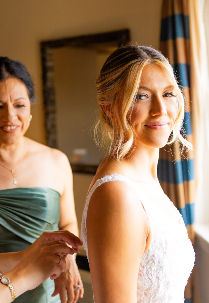 bride putting her dress on