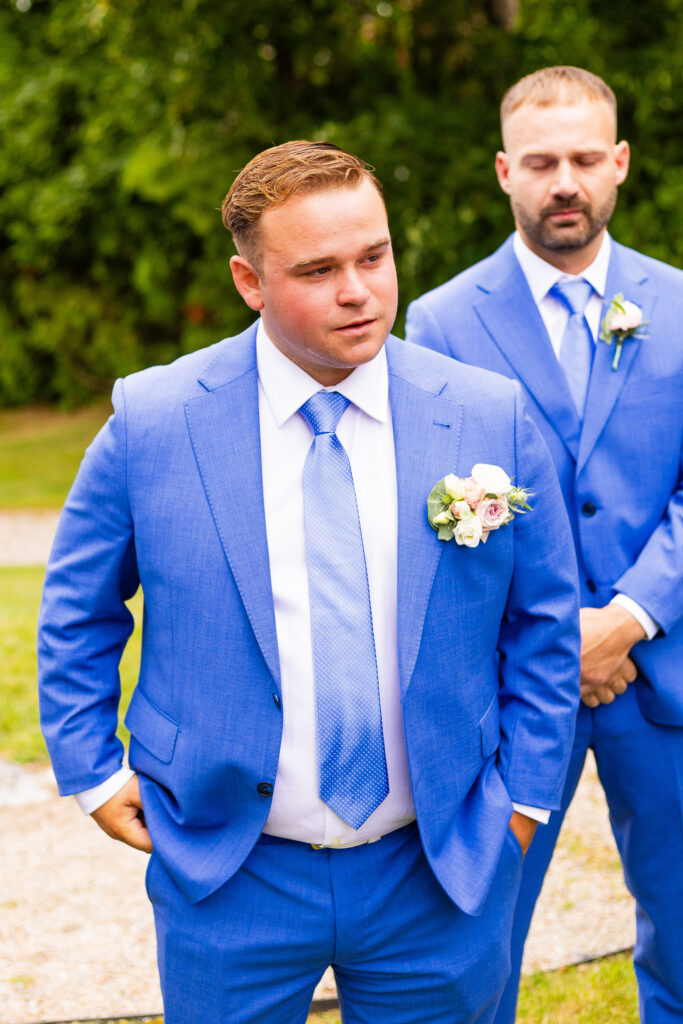 groom feels emotional as he watches his bride walk down the aisle