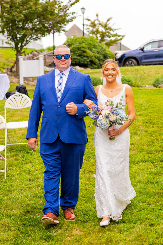 bride and father walking down the aisle at a wedding in downtown wolfeboro NH