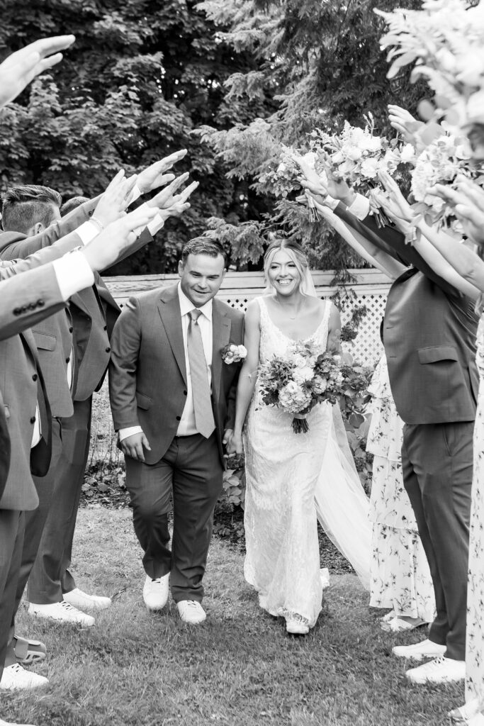 bride and groom walk together hand in hand