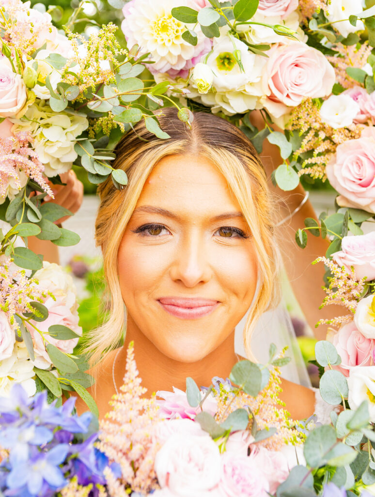 bride surrounded by flowers