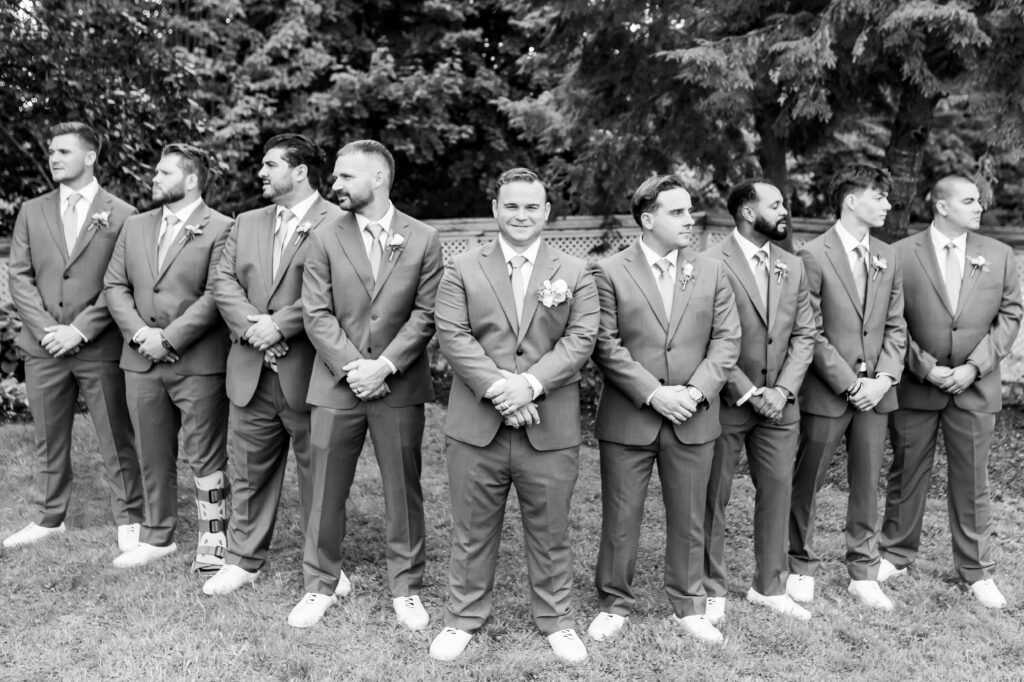 groom at a wedding on a nh lake