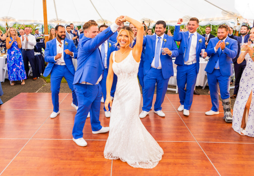 bride and groom share their first dance at a new hampshire lake wedding venue