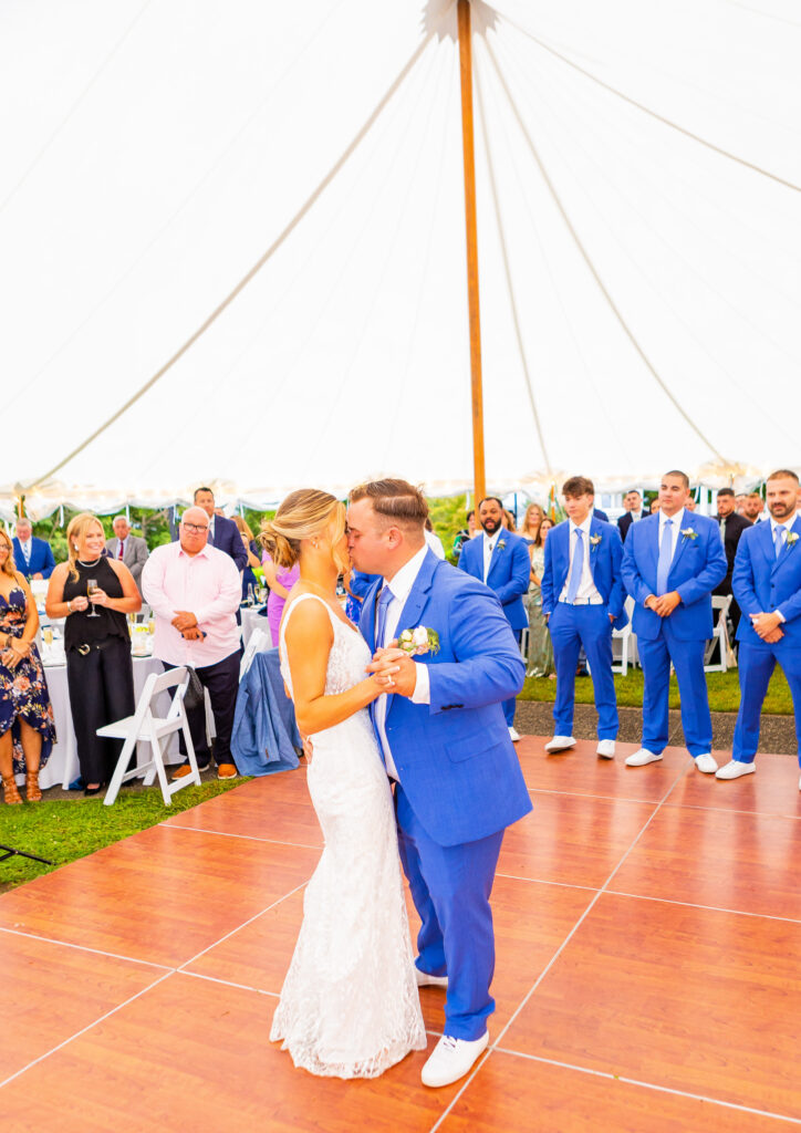 bride and groom share a kiss during their first dance 