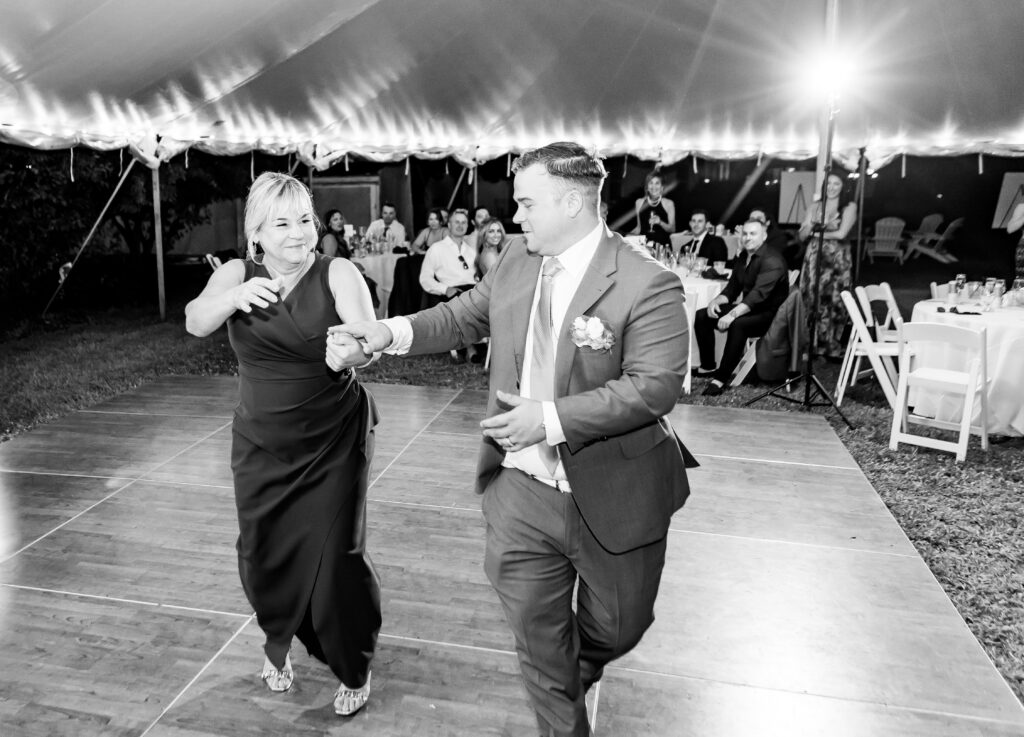 groom and son dancing 