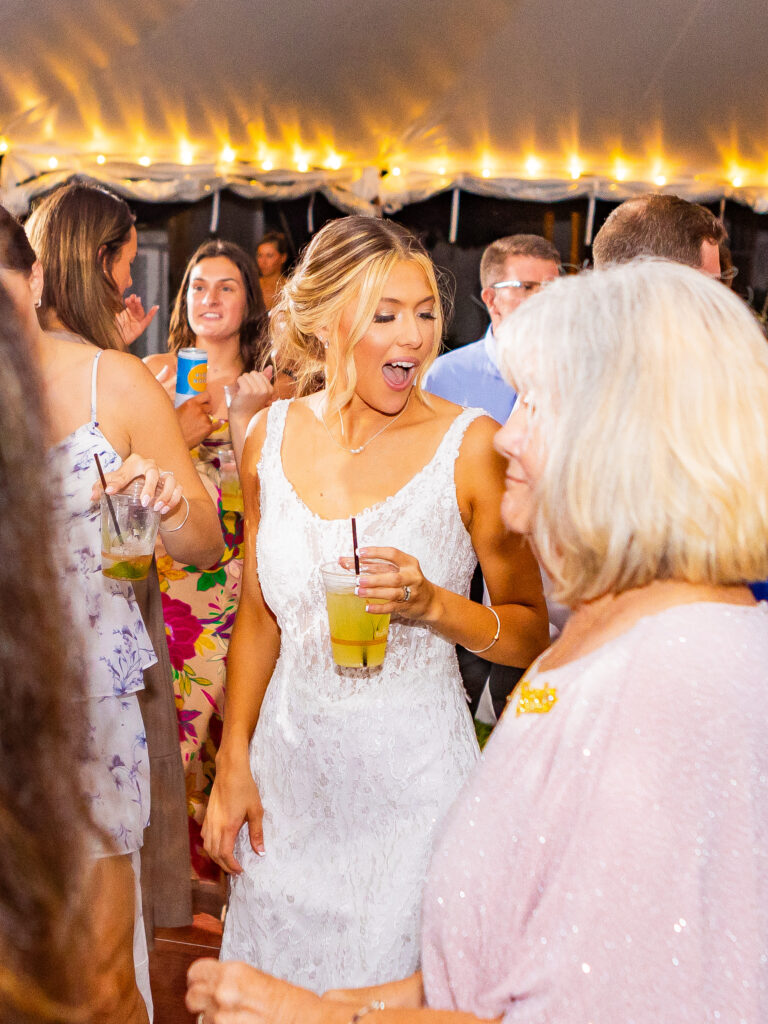 bride dancing at her wedding on lake winnipesaukee